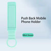 Mint green push back mobile phone holder on a light blue background