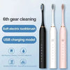 Three electric toothbrushes in black, white, and pink on a light blue background with text about features.
