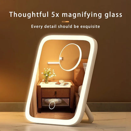 Tabletop mirror with magnifying glass on a wooden surface with a warm background.