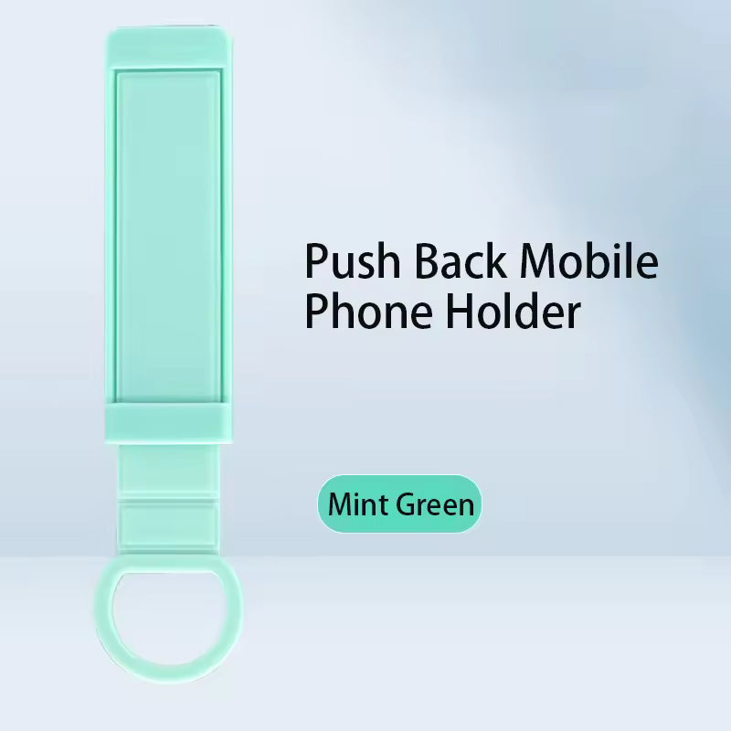 Mint green push back mobile phone holder on a light blue background