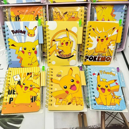 Collection of notebooks with Pikachu designs on a shelf.