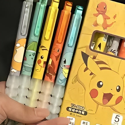Set of colorful pens with cartoon character designs, including Pikachu, held next to their packaging.