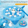 Blue penguin ice-breaking toy with game props on a blue background