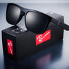 Black sunglasses with a red logo on a black box against a gray background